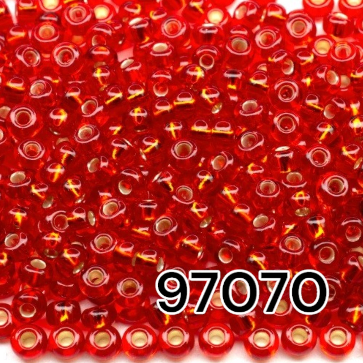 10/0 97070 Perles de graines Preciosa. Rouge transparent doublé argent.