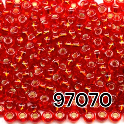 10/0 97070 Perles de graines Preciosa. Rouge transparent doublé argent.