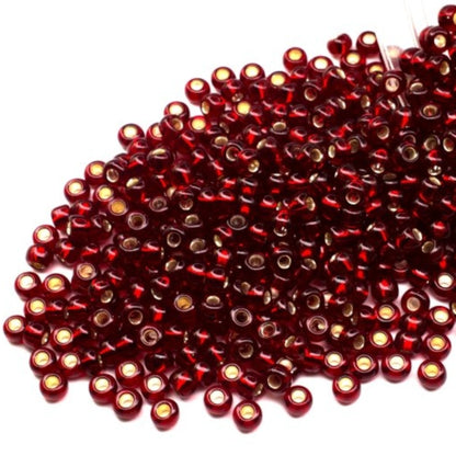 10/0 97120 Perles de graines Preciosa. Rouge transparent doublé argent.