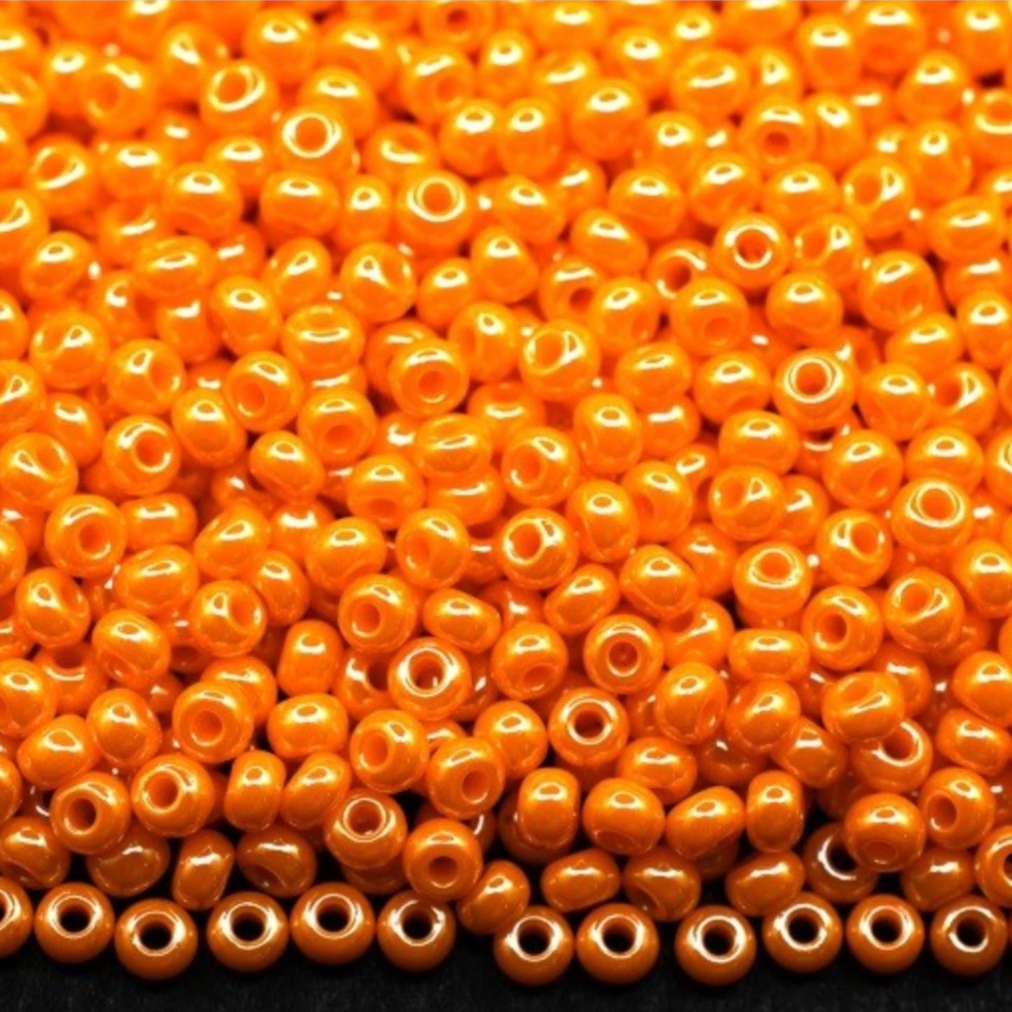 10/0 98110 Preciosa Seed Beads. Opaque Sfinx orange.