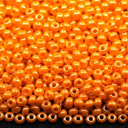 10/0 98110 Preciosa Seed Beads. Opaque Sfinx orange.