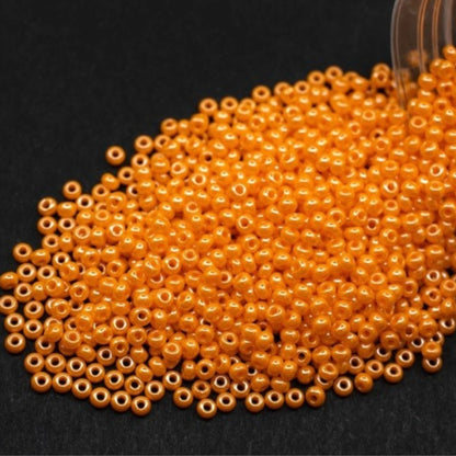 10/0 98110 Preciosa Seed Beads. Opaque Sfinx orange.