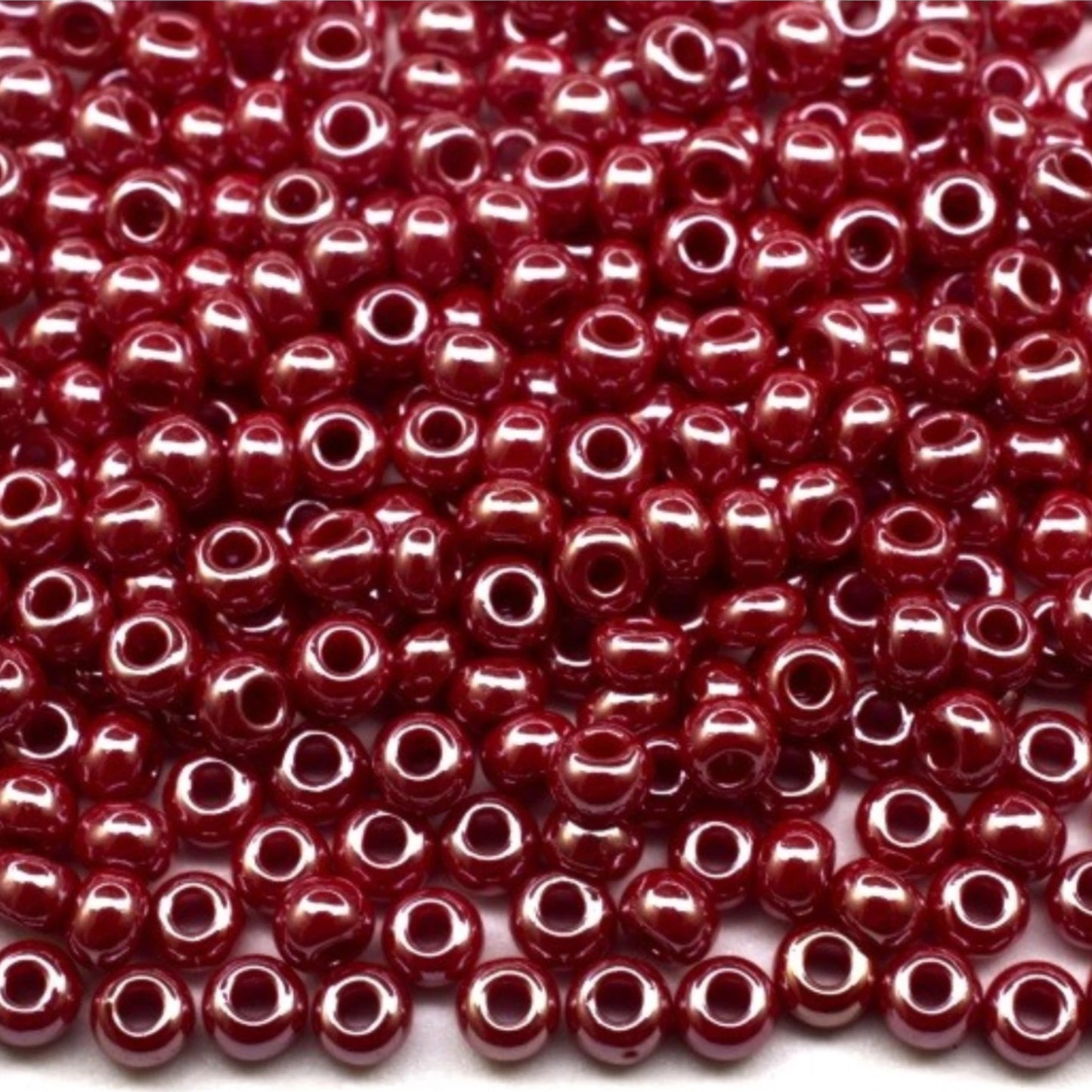 10/0 98210 Preciosa Seed Beads. Opaque Sfinx red.